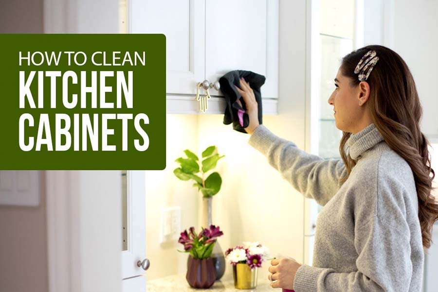 woman cleaning a kitchen cabinet